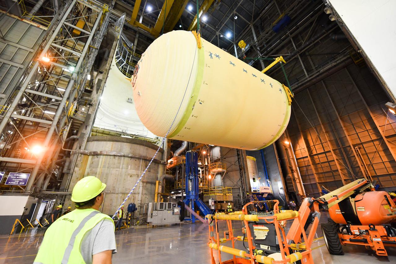 The Space Launch System (SLS) rocket’s liquid oxygen tank structural test article was manufactured and stacked in June 2019 at NASA’s Michoud Assembly Facility in New Orleans. To construct the test article, Boeing technicians at Michoud moved the liquid oxygen tank to the Vertical Assemby Building stacking and integration area. Here, they added simulators to mimic the two structures that connect to the tank, the intertank and the forward skirt.  This structural hardware for the SLS core stage for America’s new deep space rocket is structurally identical to the flight version of the tank. It will be shipped on the Pegasus barge to NASA’s Marshall Space Flight Center in Hunstville, Alabama, where it will undergo a series of tests that simulate the stresses and loads of liftoff and flight. These tests will help ensure designs are adequate for successful SLS missions to the Moon and beyond. The flight liquid oxygen tank along with the liquid hydrogen tank supplies more than 500,000 gallons of propellant to the core stages four RS-25 engines, which produce 2 million pounds of thrust to help send the SLS rocket to space.